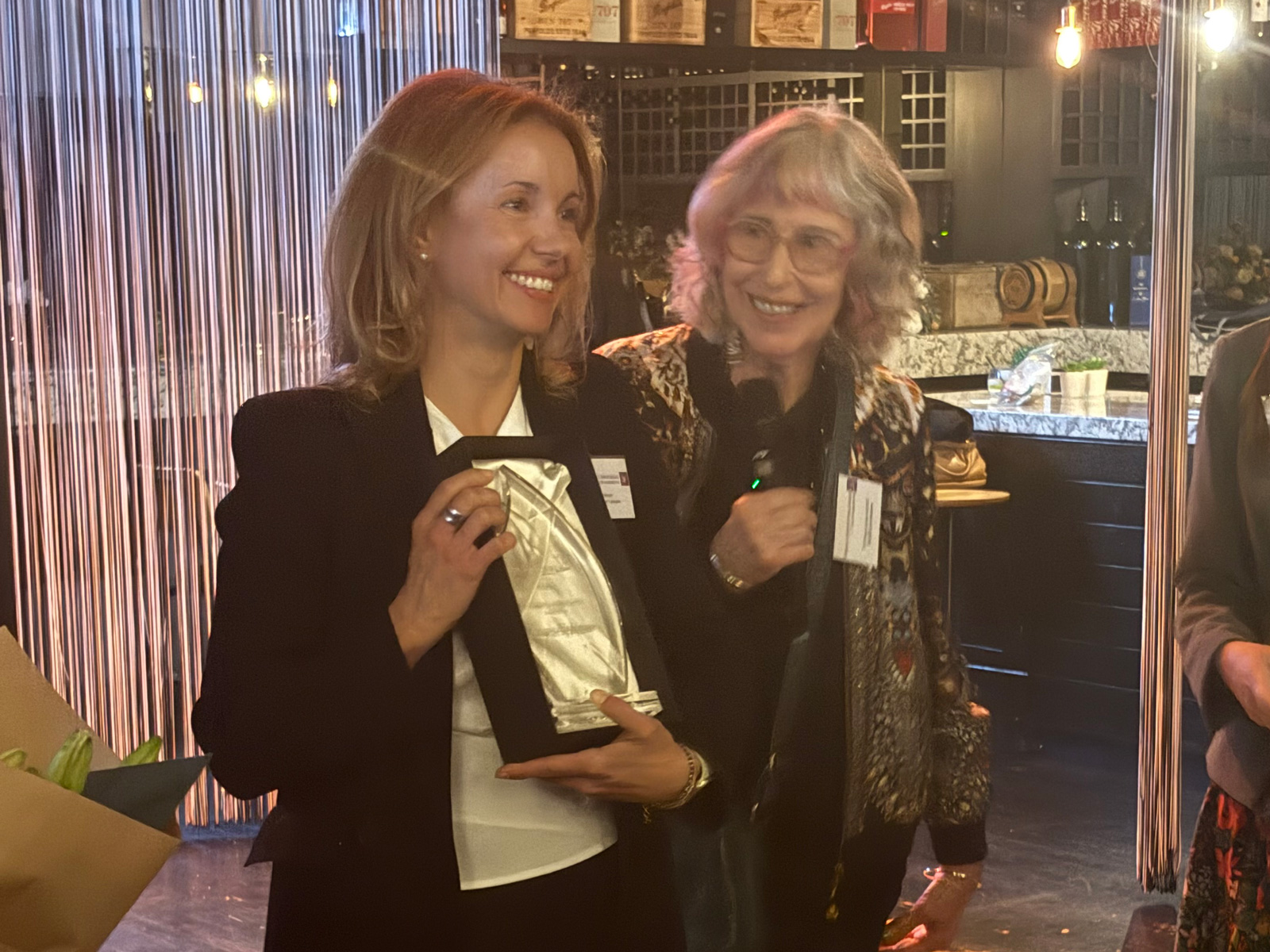 Annie Hoffman receiving her award from Dr Layton AO KC