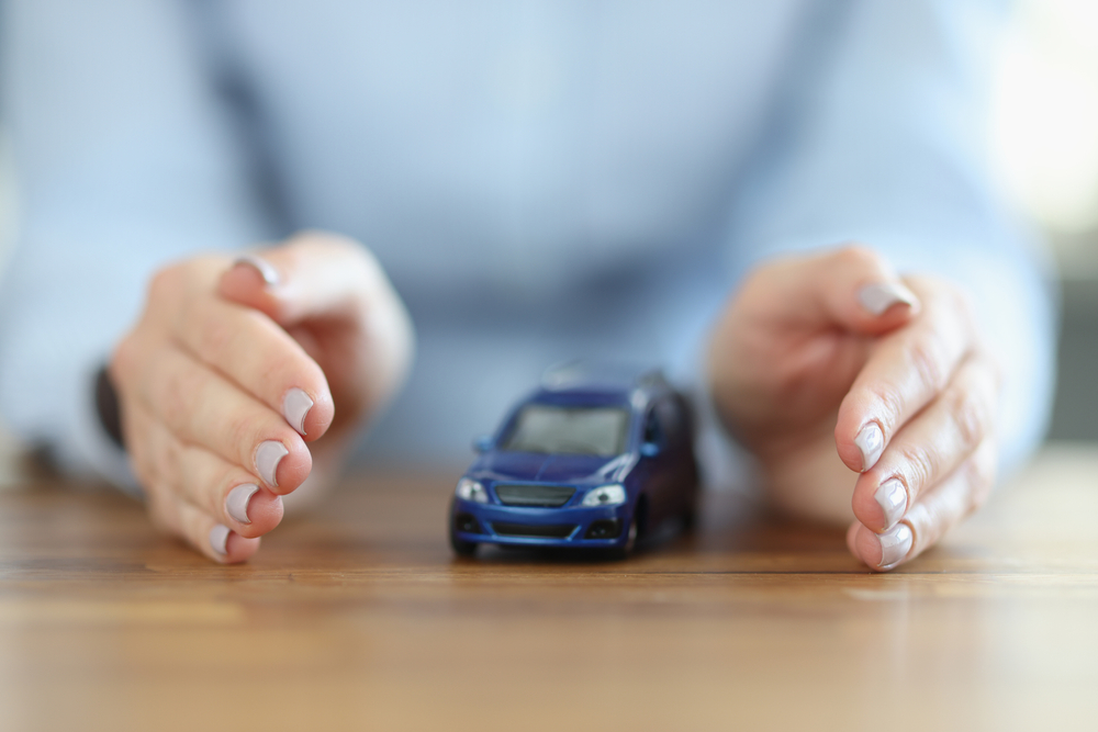 there,is,car,inside,the,woman's,hands.,transport,accident,insurance