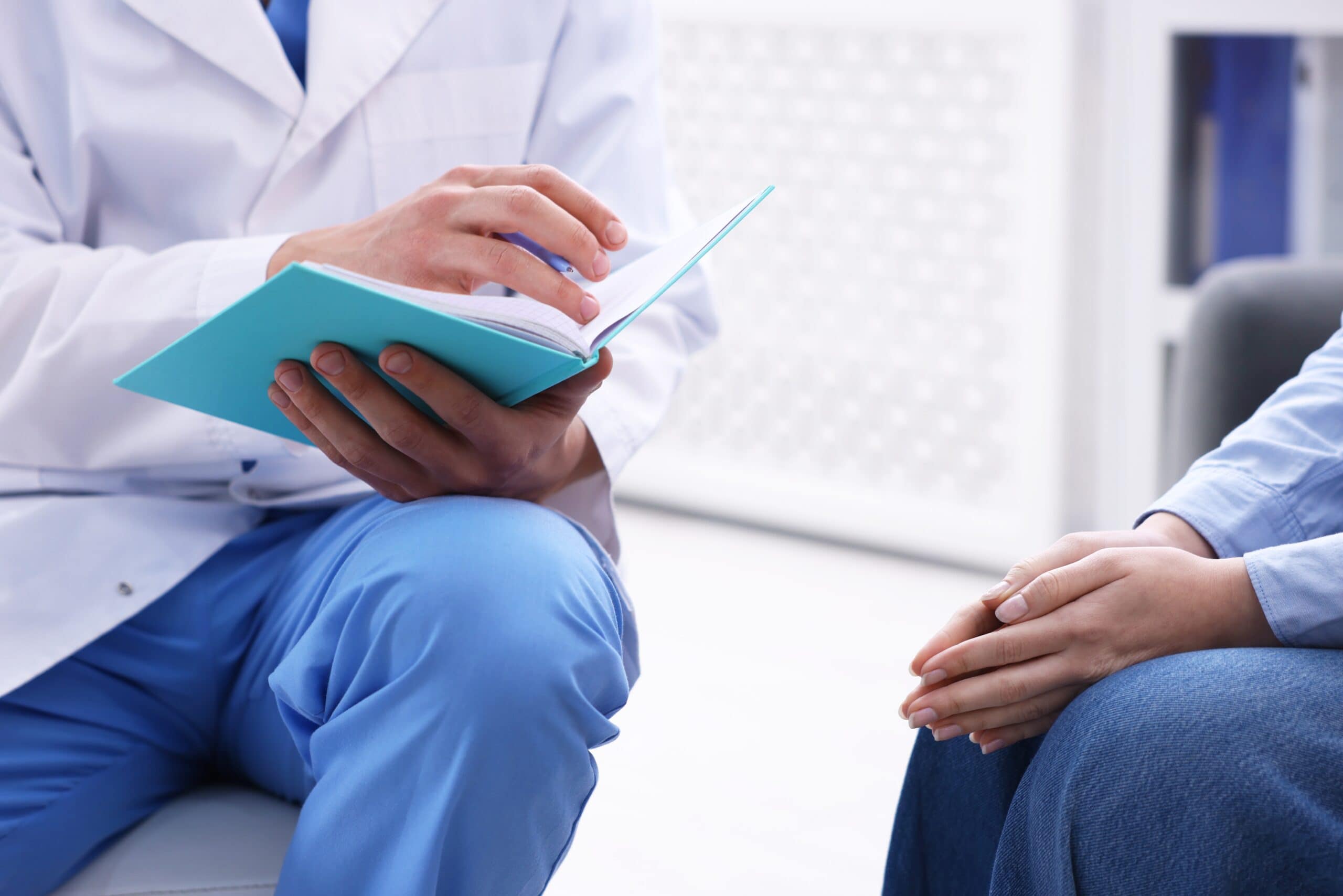 national,health,service,(nhs).,woman,having,appointment,with,doctor,indoors,